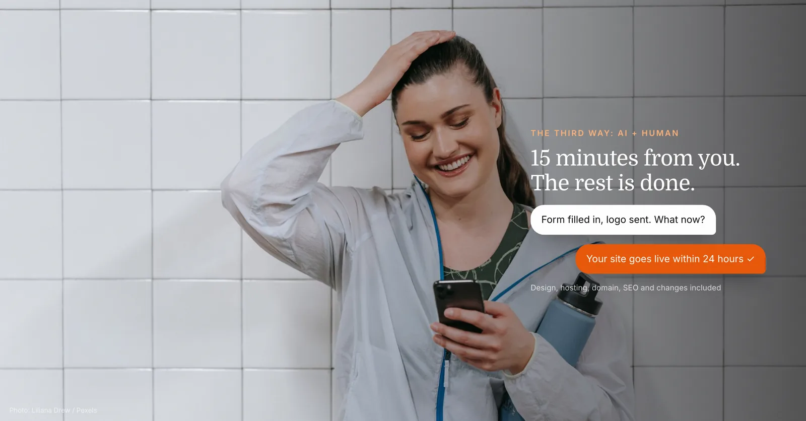 Smiling fitness coach checking her phone after ordering her professional website, built by AI and a human expert in 24 hours
